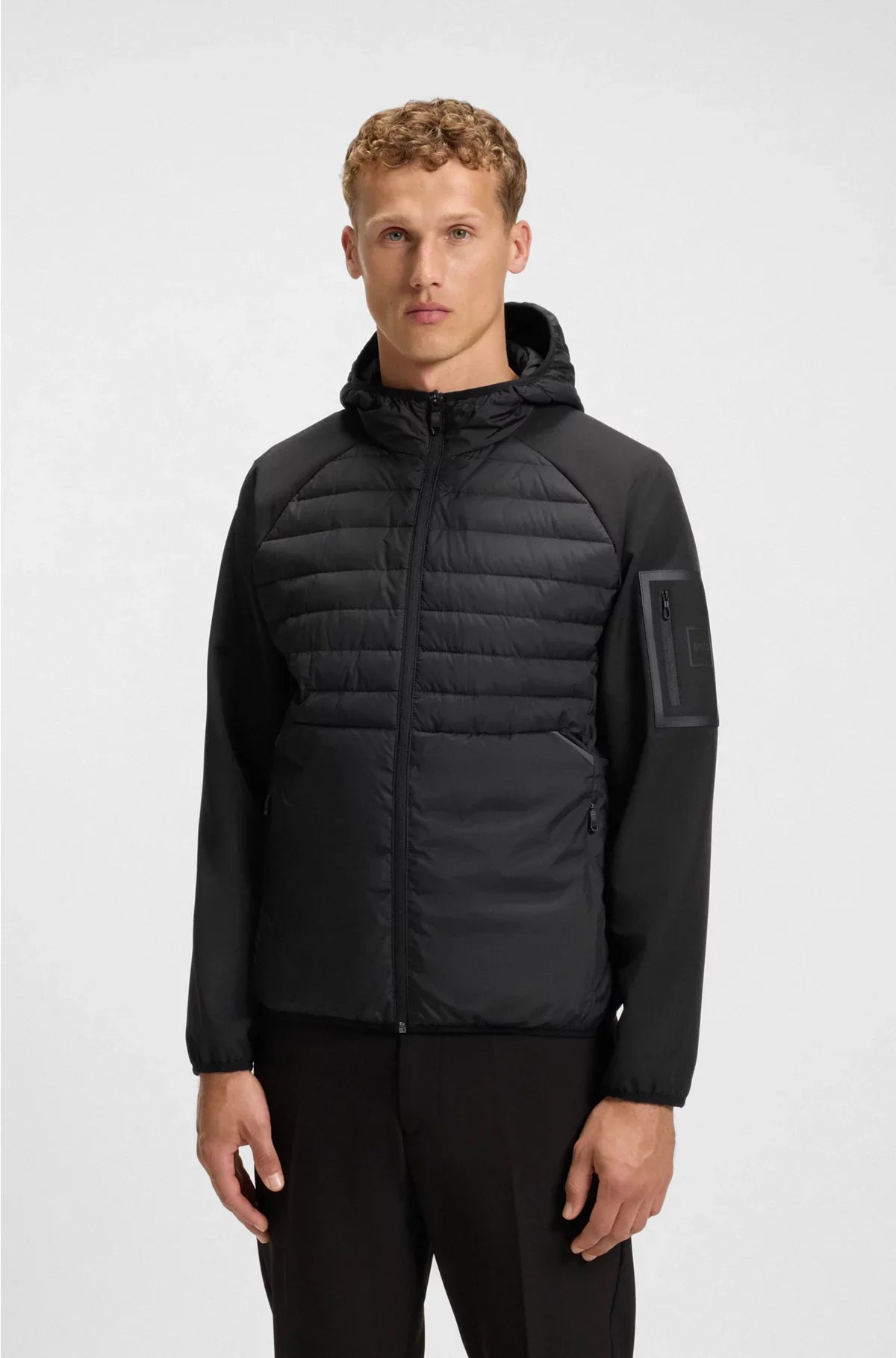 WATER-REPELLENT JACKET WITH ZIPPED SLEEVE POCKET